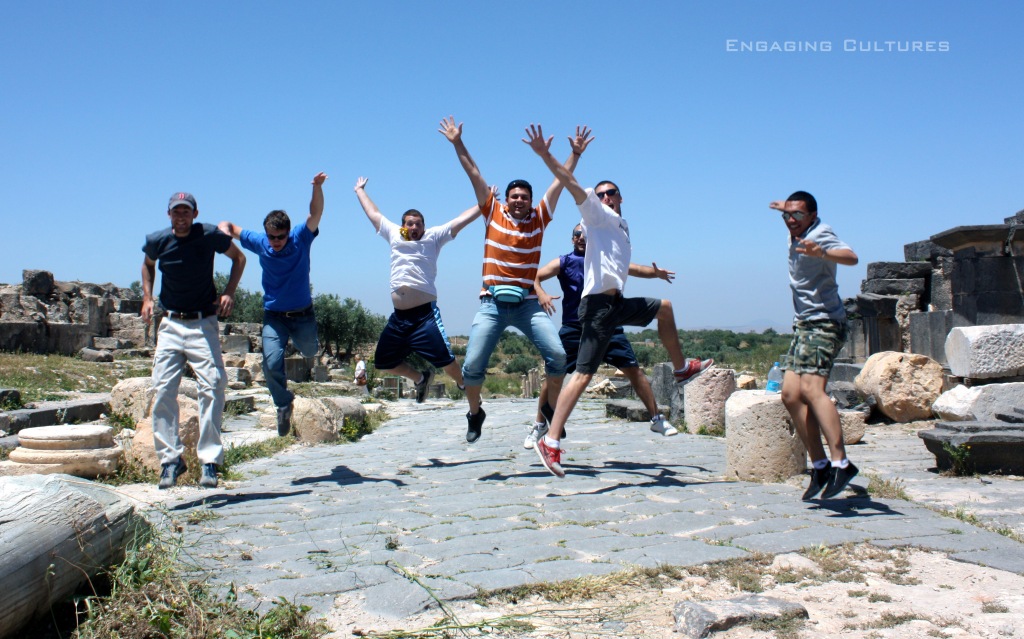 Tourist jumping at Umm Qais Jordan