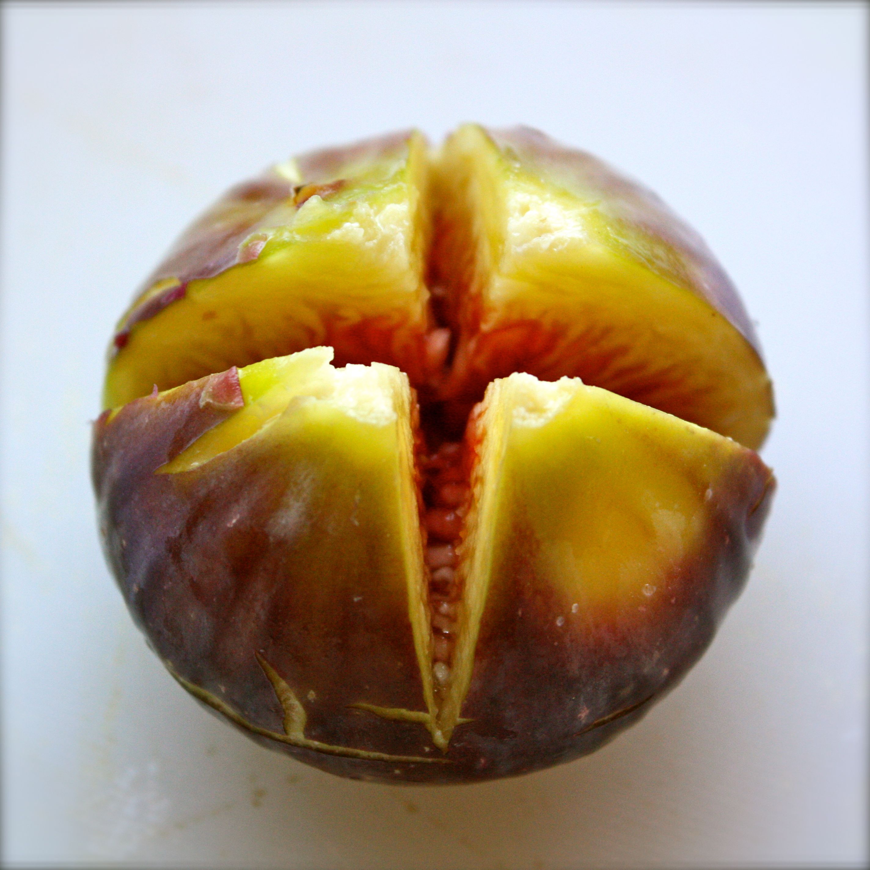 Fig with an X cut into it
