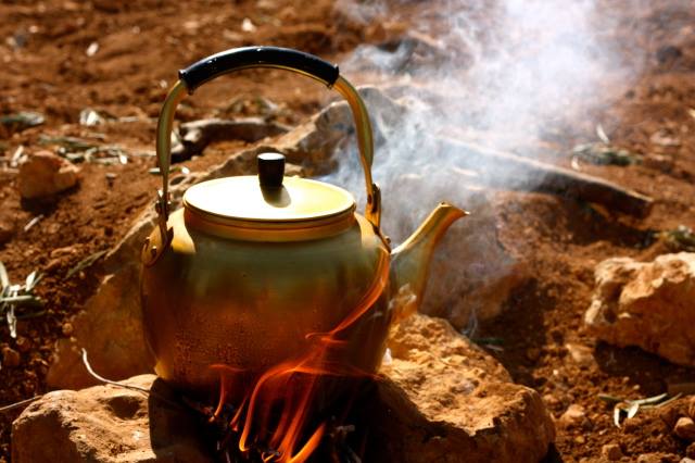 Tea pot on open fire on Jordan tour