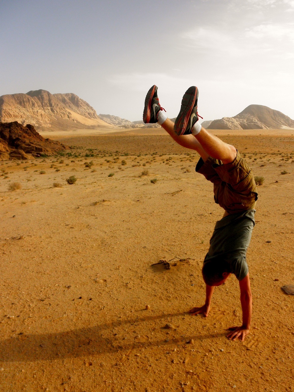 Hand Stand in Wadi Rum Jordan - Engaging Cultures Travel Jordan
