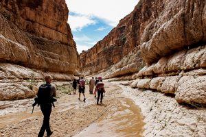 Travelers hiking in Mides canyon southern Tunisia