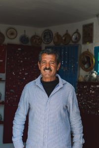 Souvenir shop seller in Takrouna Tunisia